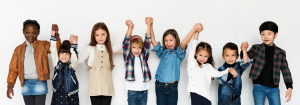 kids holding hands with arms raised