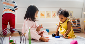 preschool kids playing on the floor